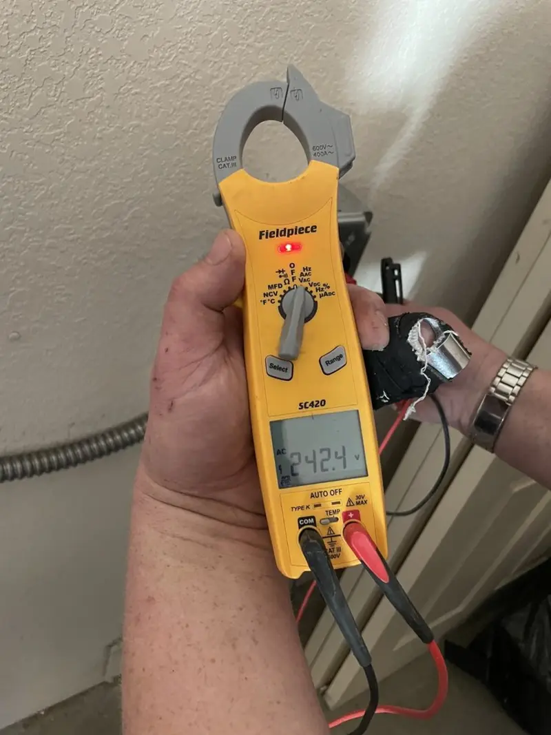 Voltage testing with clamp meter during Ceiling Fan Installation in Atkinson